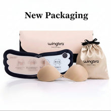 Wingbra professional silicone adhesive nude bra set with beige silicone cups, a black-and-white instruction card, a beige drawstring pouch, and a pink product box on a white background