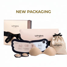 Wingbra nude bra and bra kit with beige packaging box, black ribbon, printed insert, beige drawstring pouch, and two beige wireless cups displayed on a white background with 'NEW PACKAGING' text above.